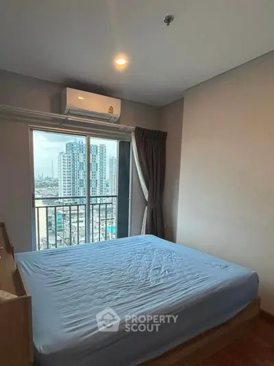 Cozy bedroom with city view and air conditioning in modern apartment