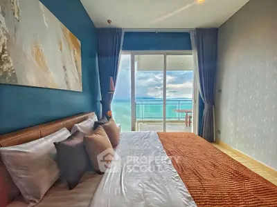 Luxurious bedroom with ocean view and balcony access in modern apartment