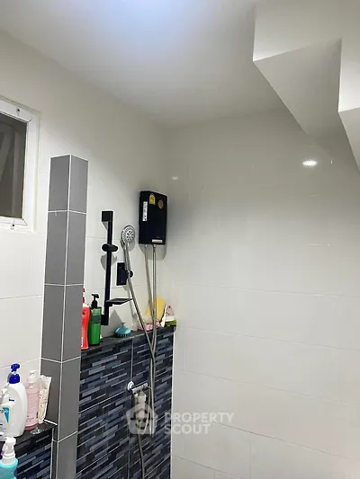 Modern bathroom with sleek shower design and tiled walls