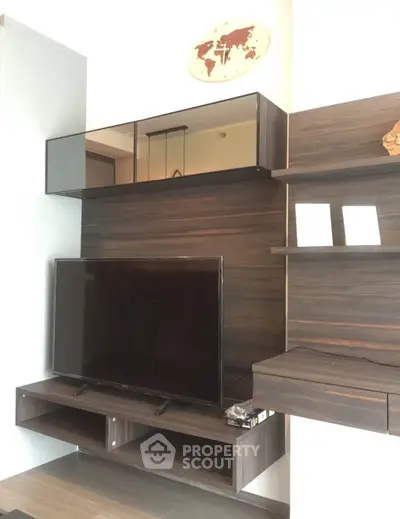 Modern living room with sleek TV unit and stylish shelving