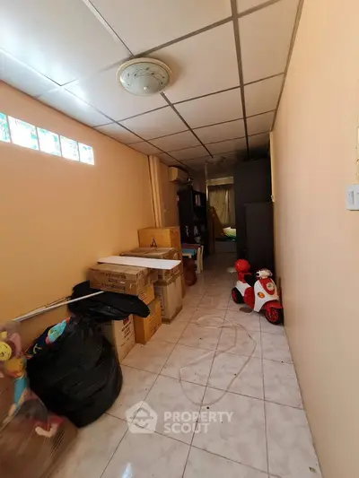 Spacious storage room with tiled floor and ample shelving space