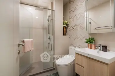 Modern bathroom with glass shower and stylish decor