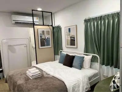 Cozy bedroom with modern decor and air conditioning in a stylish apartment.