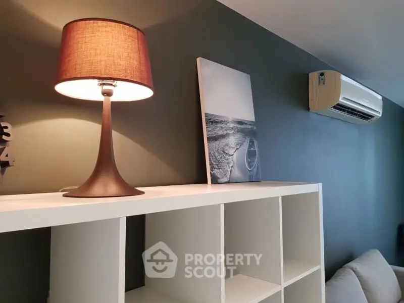 Modern living room with stylish lamp and air conditioning unit