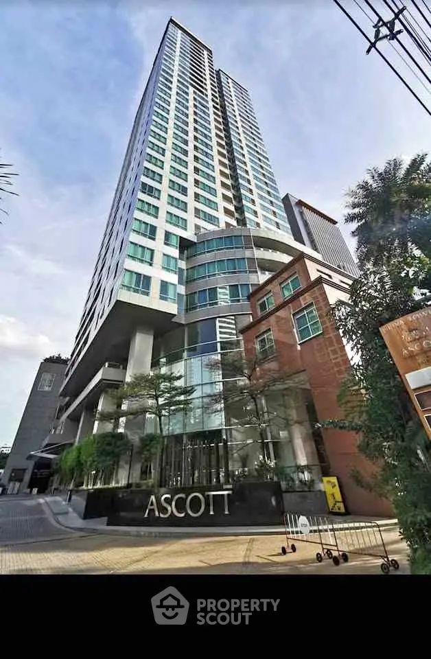 Stunning high-rise building with modern architecture and lush greenery at Ascott.