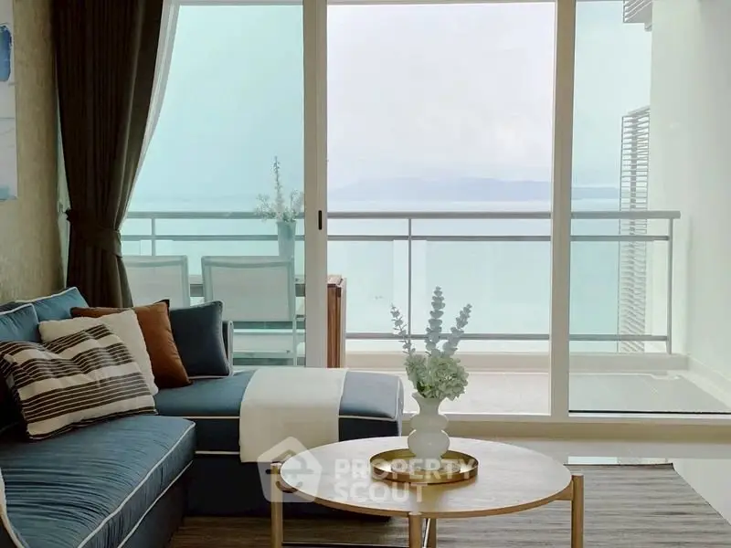 Stunning living room with ocean view and elegant decor, perfect for relaxation.
