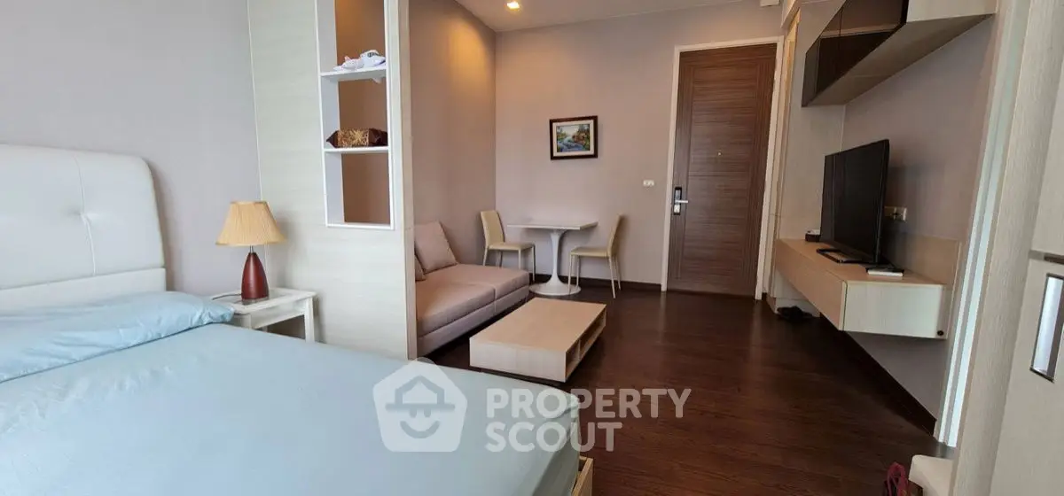 Modern studio apartment with cozy living area and stylish decor