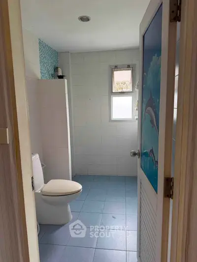 Spacious bathroom with modern fixtures and natural light