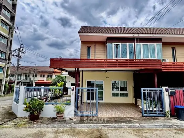 Charming corner unit townhouse with spacious balcony and modern exterior design.