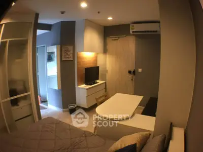 Modern studio apartment with cozy interior design and efficient use of space.