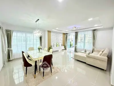 Spacious modern living room with elegant dining area and luxurious decor