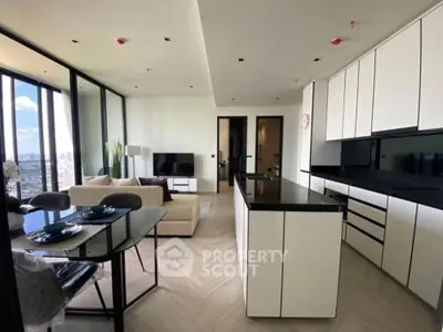 Modern open-layout kitchen and living area with city view, sleek cabinetry, and elegant dining setup.