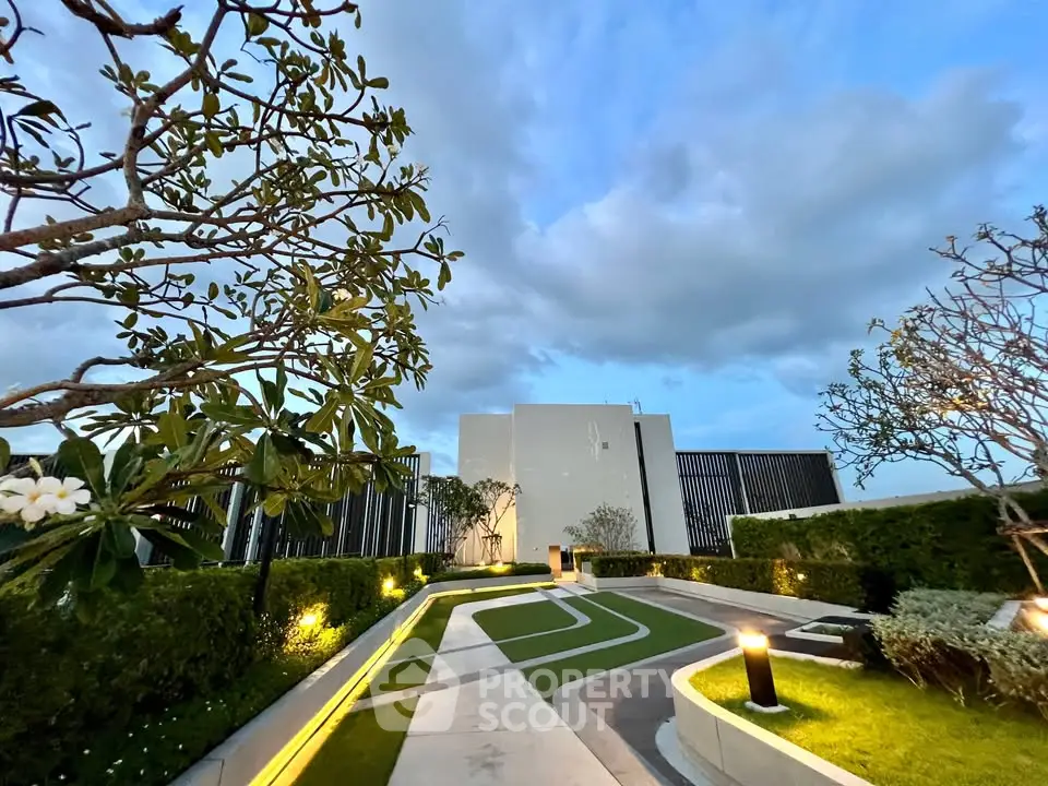 Luxurious rooftop garden with modern landscaping and ambient lighting