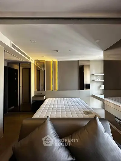 Luxurious modern bedroom with sleek design and ambient lighting
