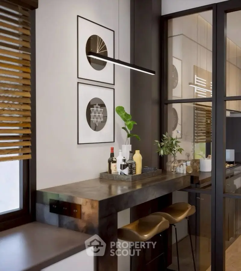 Modern kitchen with sleek bar seating and stylish decor