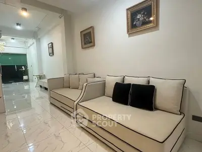 Elegant living room with modern sofas and marble flooring