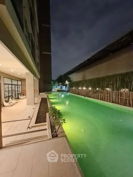 Luxurious apartment with stunning night pool view and modern design.