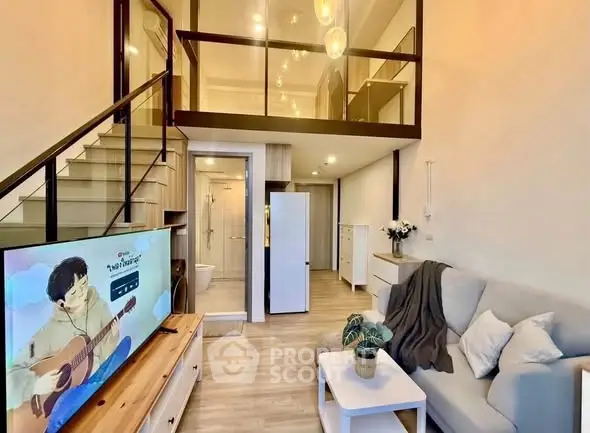 Modern loft apartment with stylish living room and mezzanine, featuring cozy decor and elegant lighting.