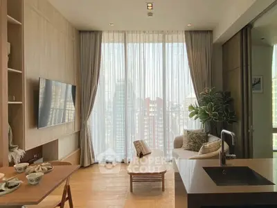 Modern living room with large windows and city view, featuring stylish furniture and open layout.