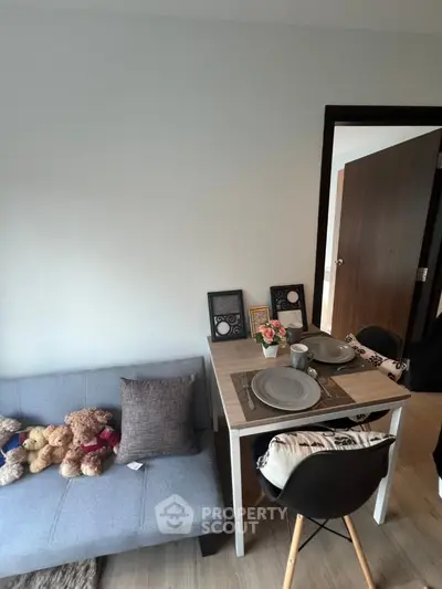 Cozy living room with dining area and plush seating in modern apartment