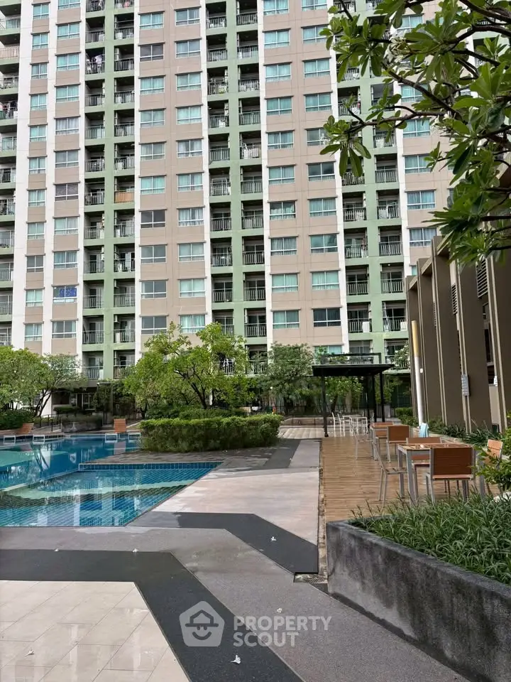 Modern condominium with pool and lush greenery, perfect for urban living.