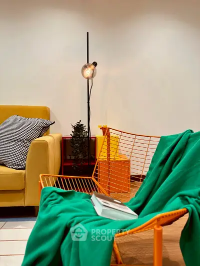 Stylish modern living room with vibrant furniture and cozy ambiance.