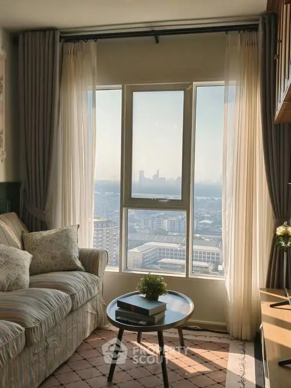 Charming living room with stunning city view, cozy sofa, and elegant decor.