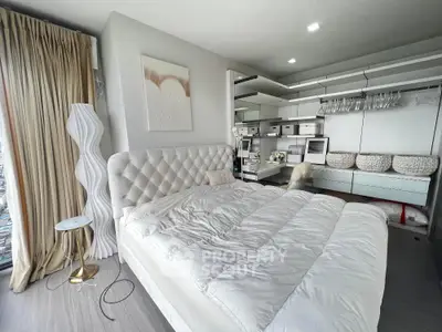 Luxurious modern bedroom with elegant decor and ample storage space