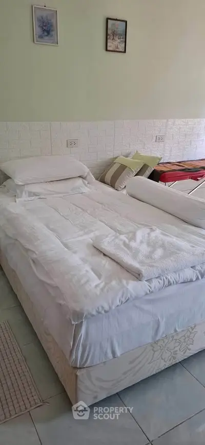 Cozy bedroom with comfortable bed and stylish decor, perfect for relaxation and rest.