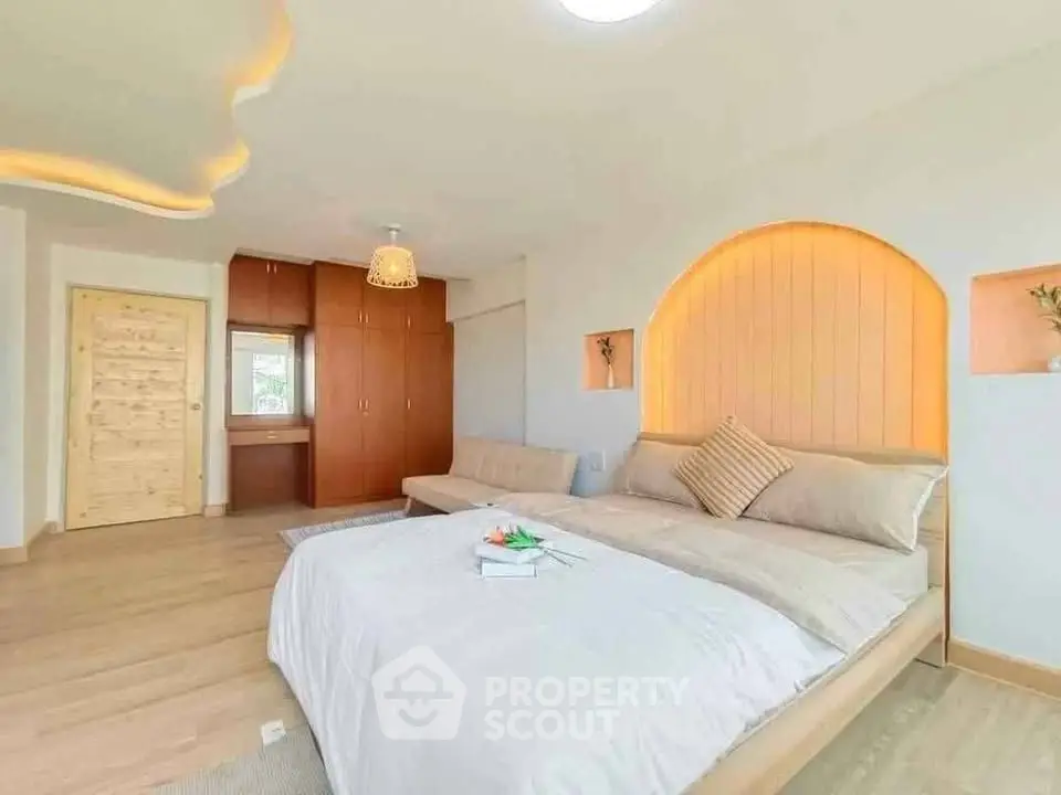Spacious bedroom with modern design and cozy lighting