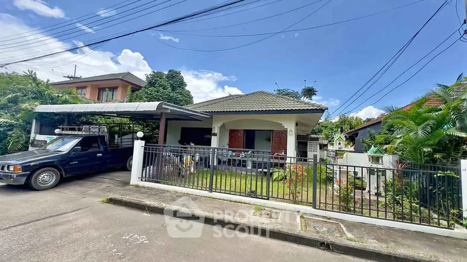 Charming single-story house with carport and lush garden in a serene neighborhood.