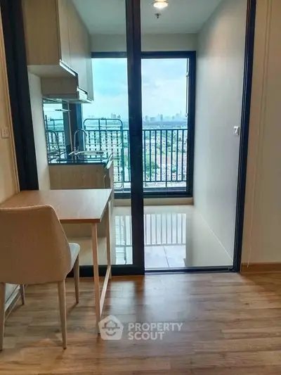 Modern apartment with balcony offering stunning city views and sleek interior design.