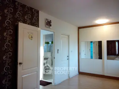 Spacious bedroom with modern decor and en-suite bathroom
