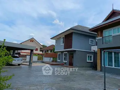 Spacious modern house with large driveway and carport in serene neighborhood.
