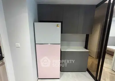 Modern kitchen with sleek cabinets and stylish refrigerator