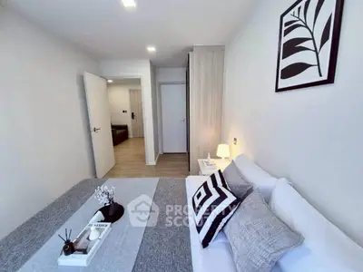 Modern bedroom with stylish decor and cozy ambiance in a contemporary apartment.