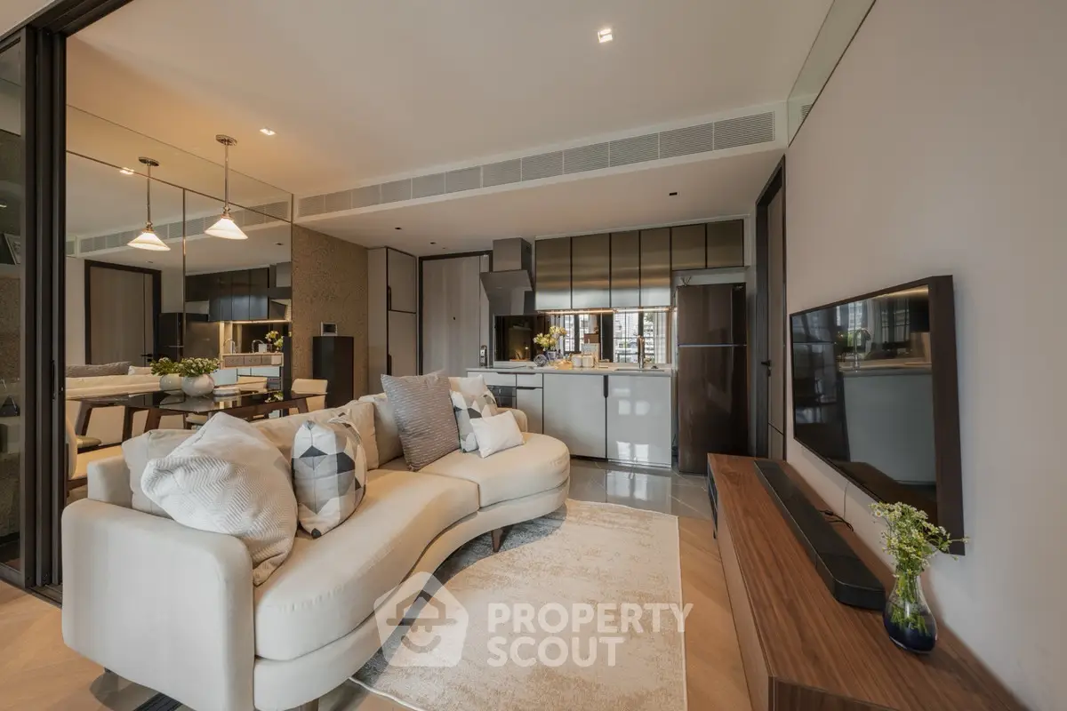 Luxurious open-plan living room with modern kitchen and elegant decor