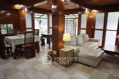 Charming living room with elegant dining area and garden view