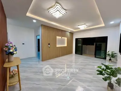 Spacious modern living room with elegant lighting and stylish decor