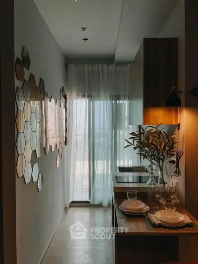 Stylish kitchen with modern decor and natural light in a contemporary apartment.
