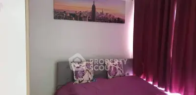 Cozy bedroom with plush bedding and cityscape artwork, perfect for relaxation.