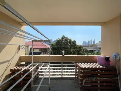 Spacious balcony with city view, perfect for relaxation and outdoor activities.