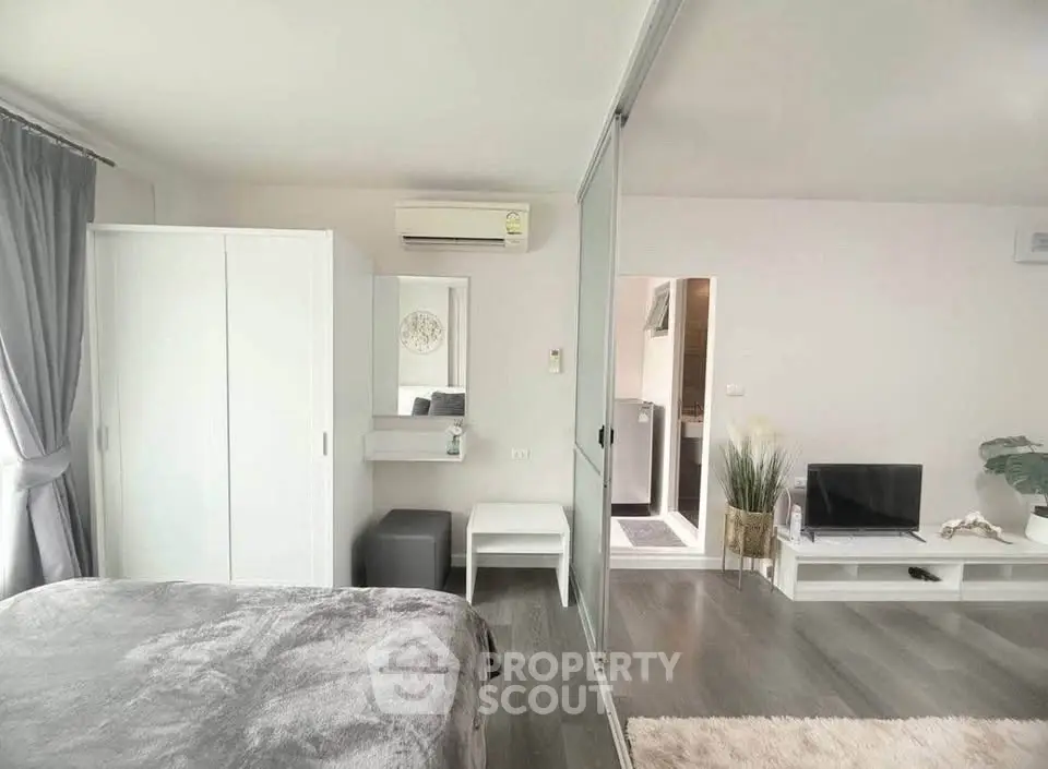 Modern bedroom with sliding glass doors and stylish decor
