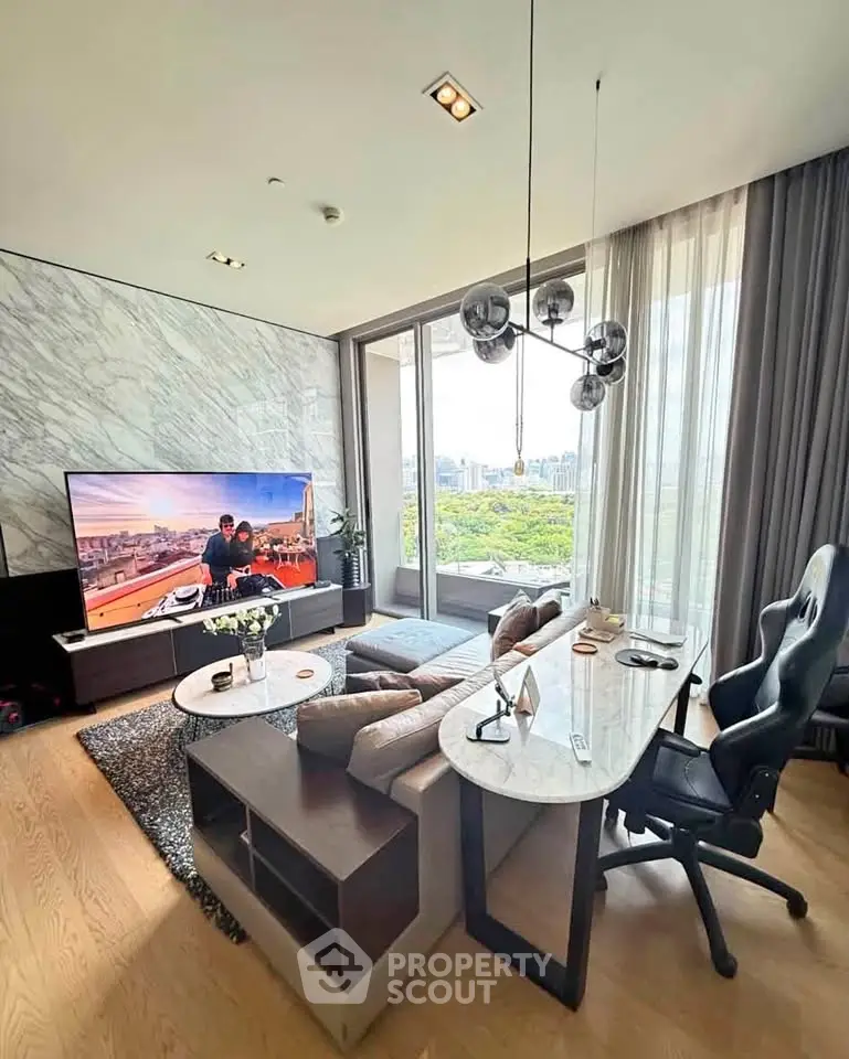 Luxurious living room with modern decor, large TV, and stunning city view from balcony.