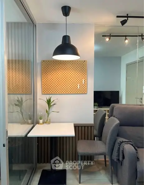 Cozy modern living space with stylish decor and comfortable seating.