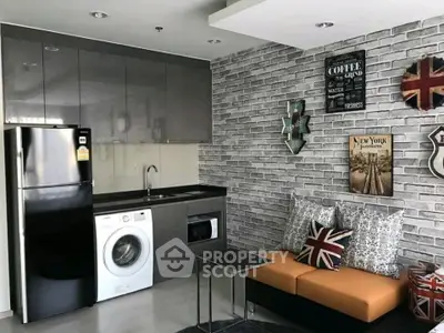 Stylish modern kitchen with washing machine and cozy seating area in urban apartment.