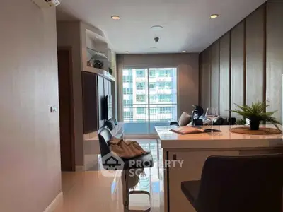 Modern living room with sleek design and large window offering natural light.