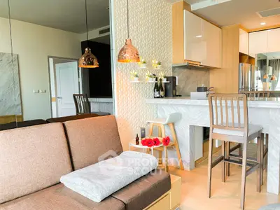 Modern open-layout living room with stylish kitchen and cozy seating area