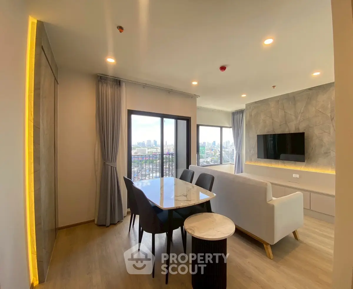 Modern living room with city view, stylish furniture, and elegant lighting.