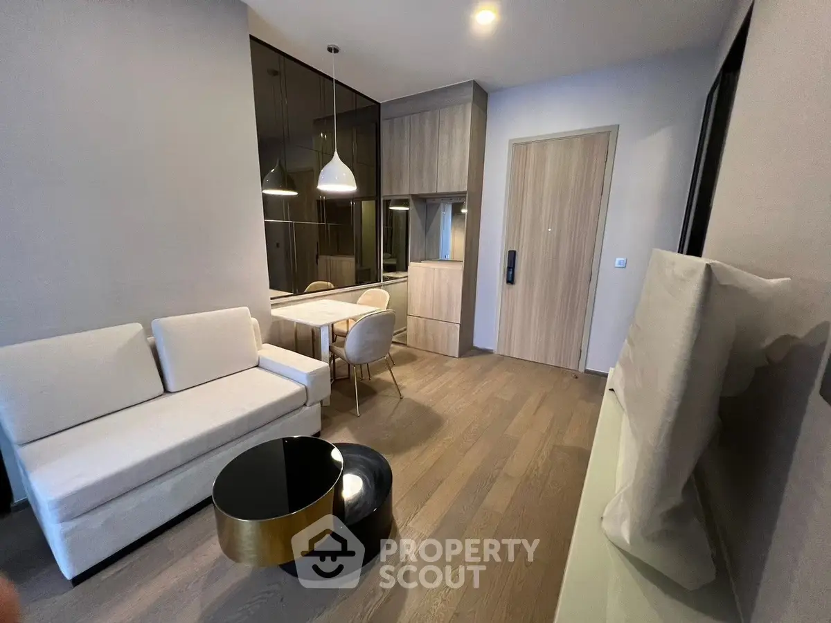 Modern living room with sleek furniture and stylish decor in a contemporary apartment.